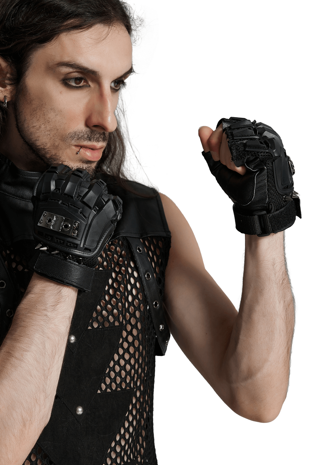 Person wearing cyberpunk spiked armored gloves with hard shell protection and metal studs on sheepskin palm.