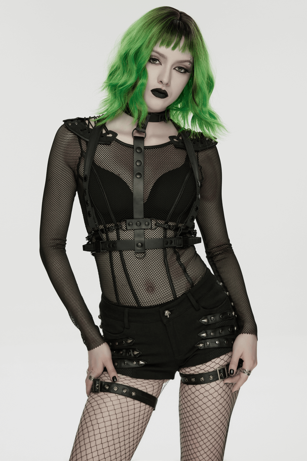 Cyberpunk Spine Tail Harness with Chains and Buckles showcased by a model in a stylish cyberpunk outfit with green hair.