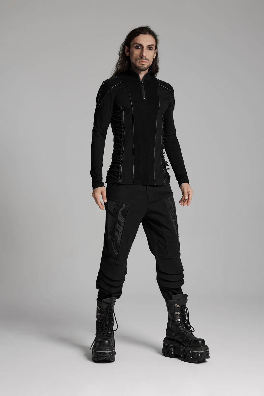 Cyberpunk stand collar sweatshirt with rivet straps, paired with stylish black pants and boots for a bold look.