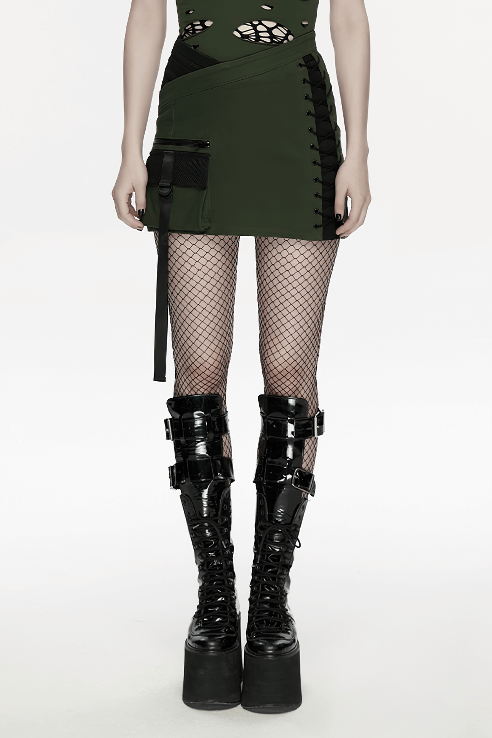 Cyberpunk Tactical Mini Skirt With Lace Up and Pockets worn with fishnet stockings and chunky buckle boots.