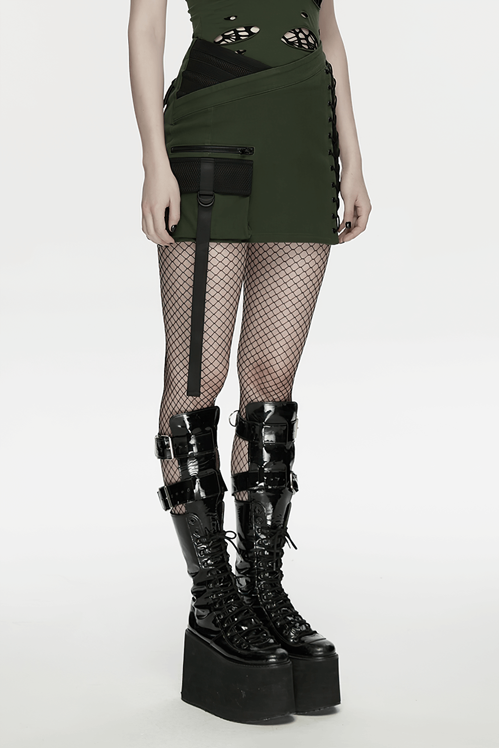 Cyberpunk Tactical Mini Skirt With Lace Up and Pockets styled with fishnet stockings and platform boots.