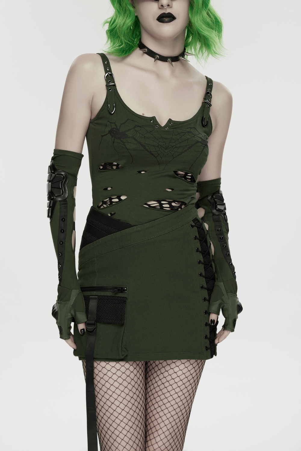 Cyberpunk Tactical Mini Skirt With Lace Up and Pockets worn by a model with green hair and edgy accessories.