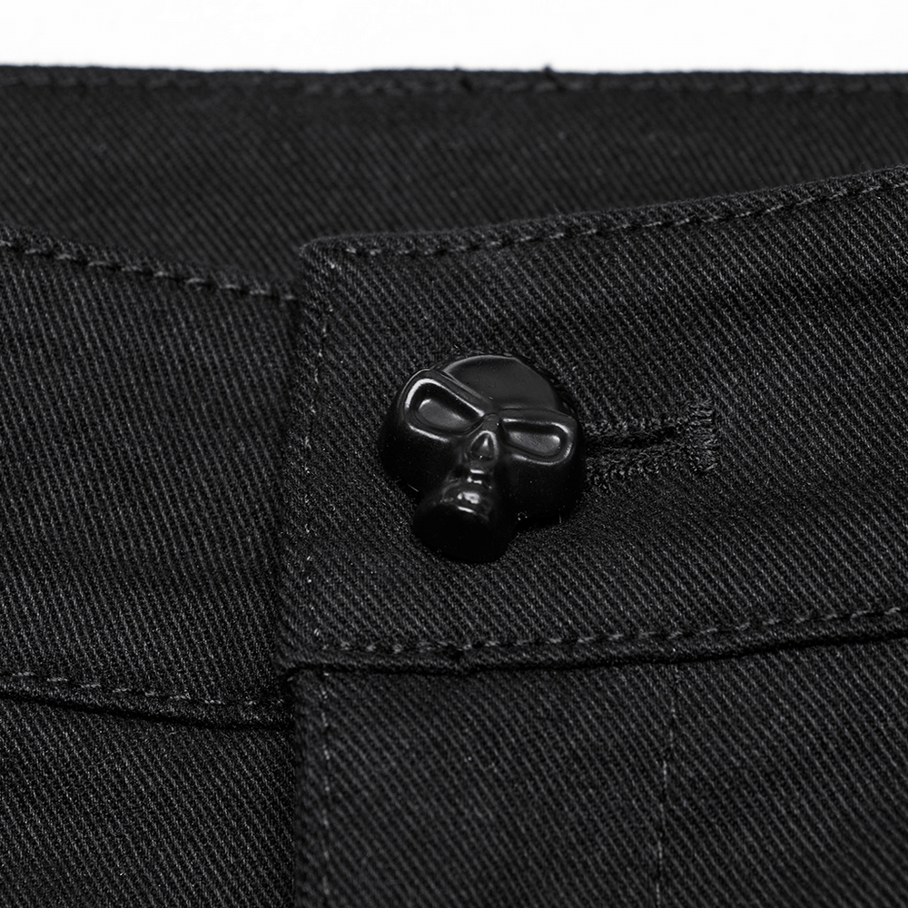 Close-up of a black skull button detail on Cyberpunk trousers, adding edgy style to your outfit.