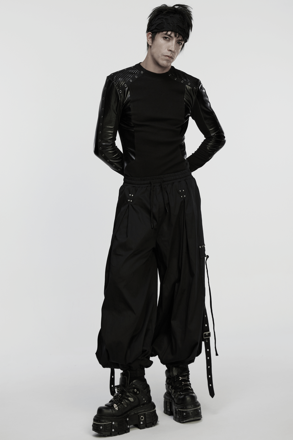 Cyberpunk Top with Metal Studs and Mesh Accents, featuring black ribbed fabric and leather look panels.