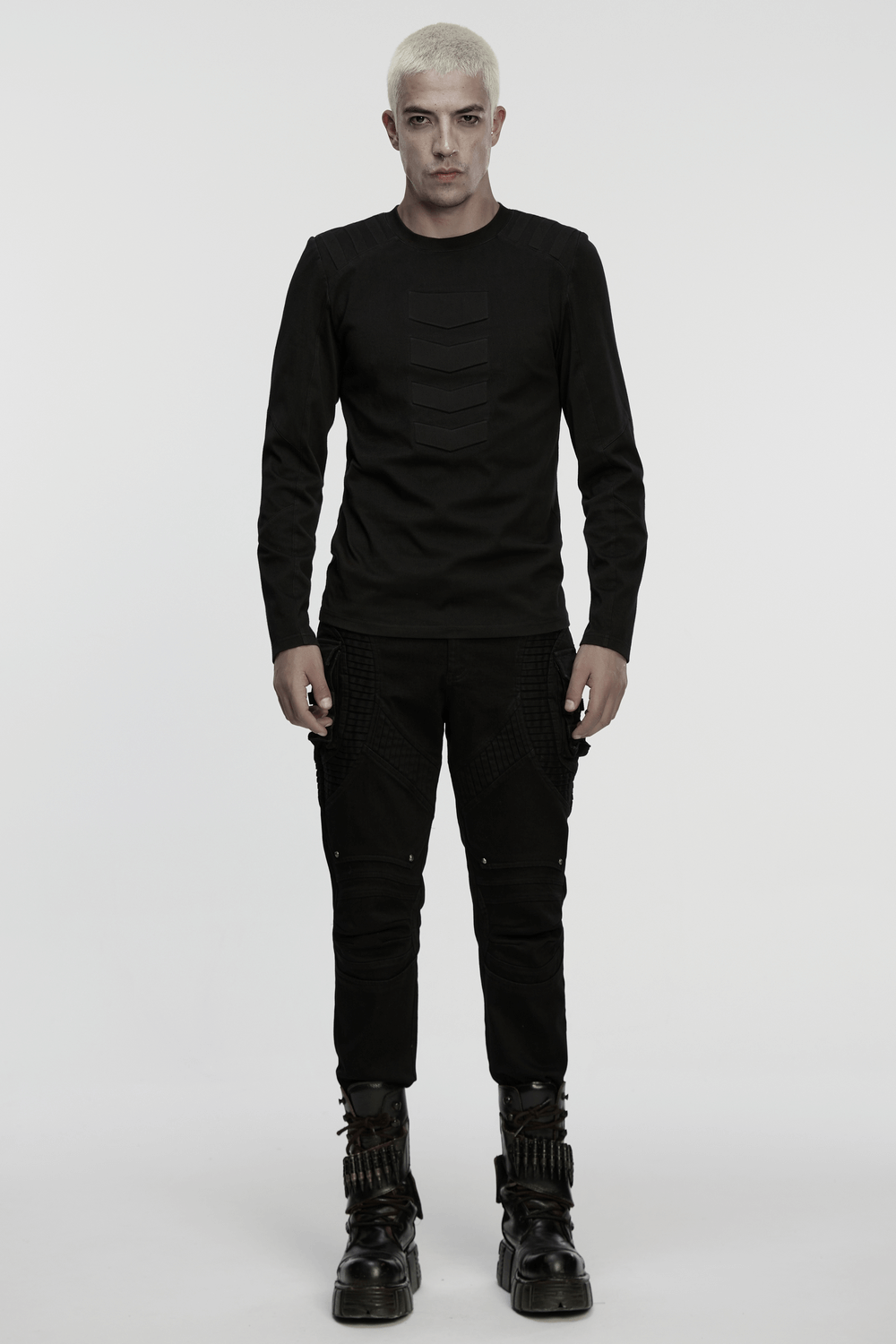 Cyberpunk Top with Structured Panels and Shoulder Detail worn by a model in black tactical has 3D panel design.