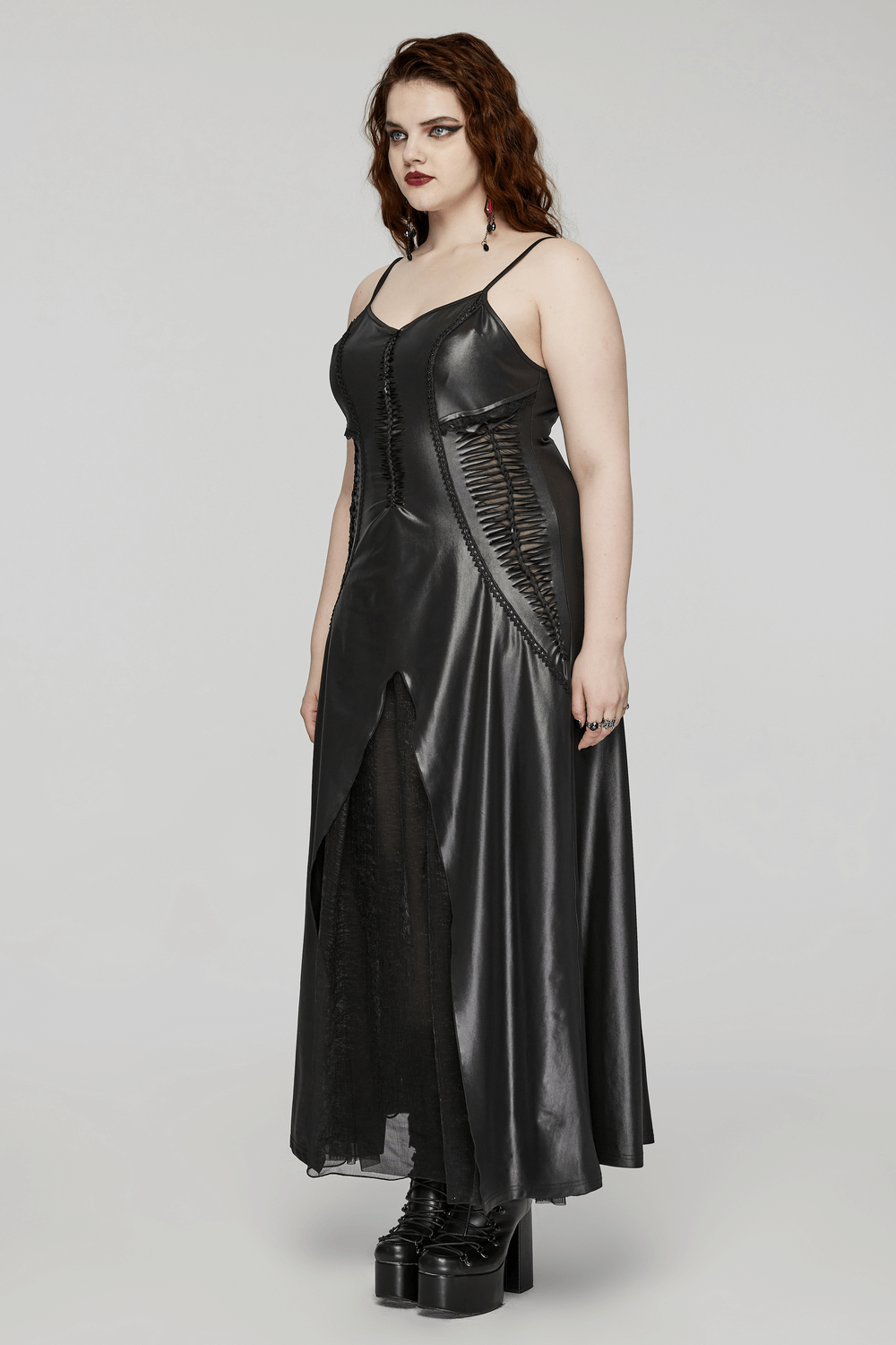 Women’s black gothic maxi dress with straps, lace-up back, and hollow-out design for an edgy look.