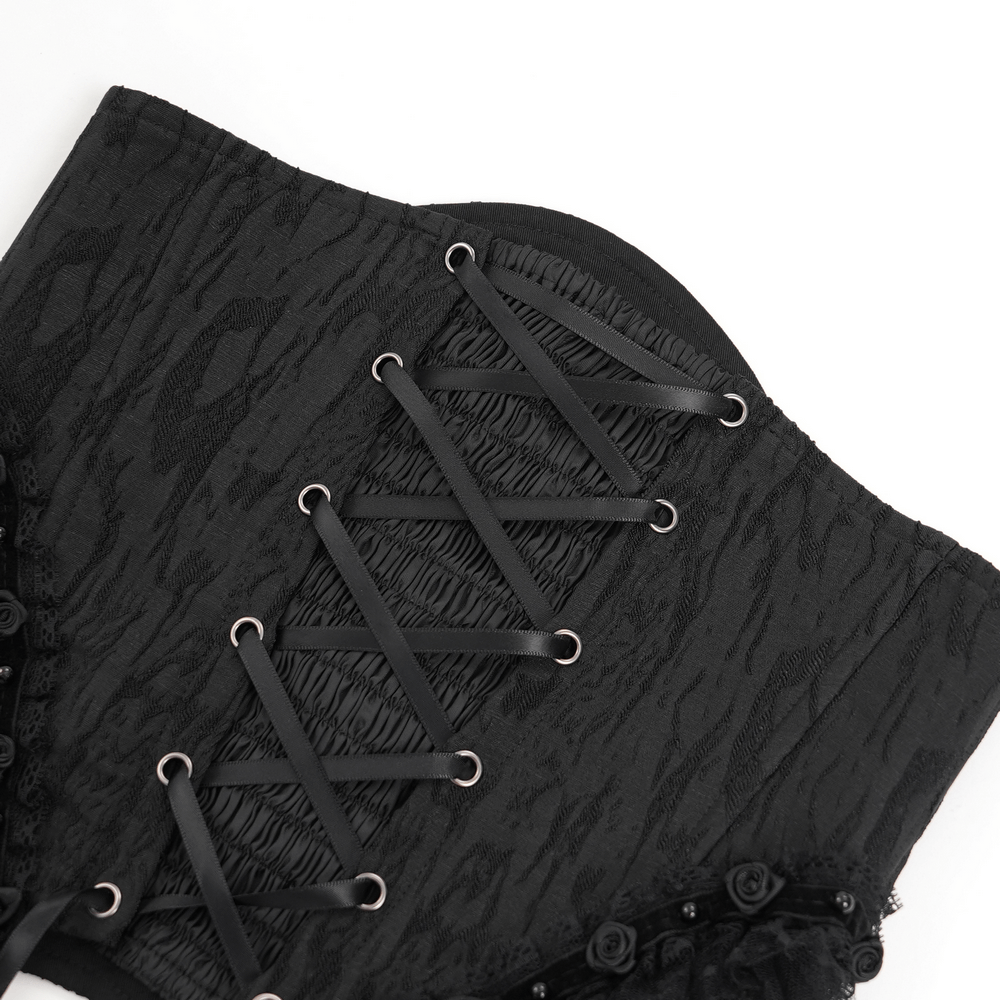 Black lace up detail of Dark Elegance Underbust Corset featuring tulle and lace for a gothic aesthetic.