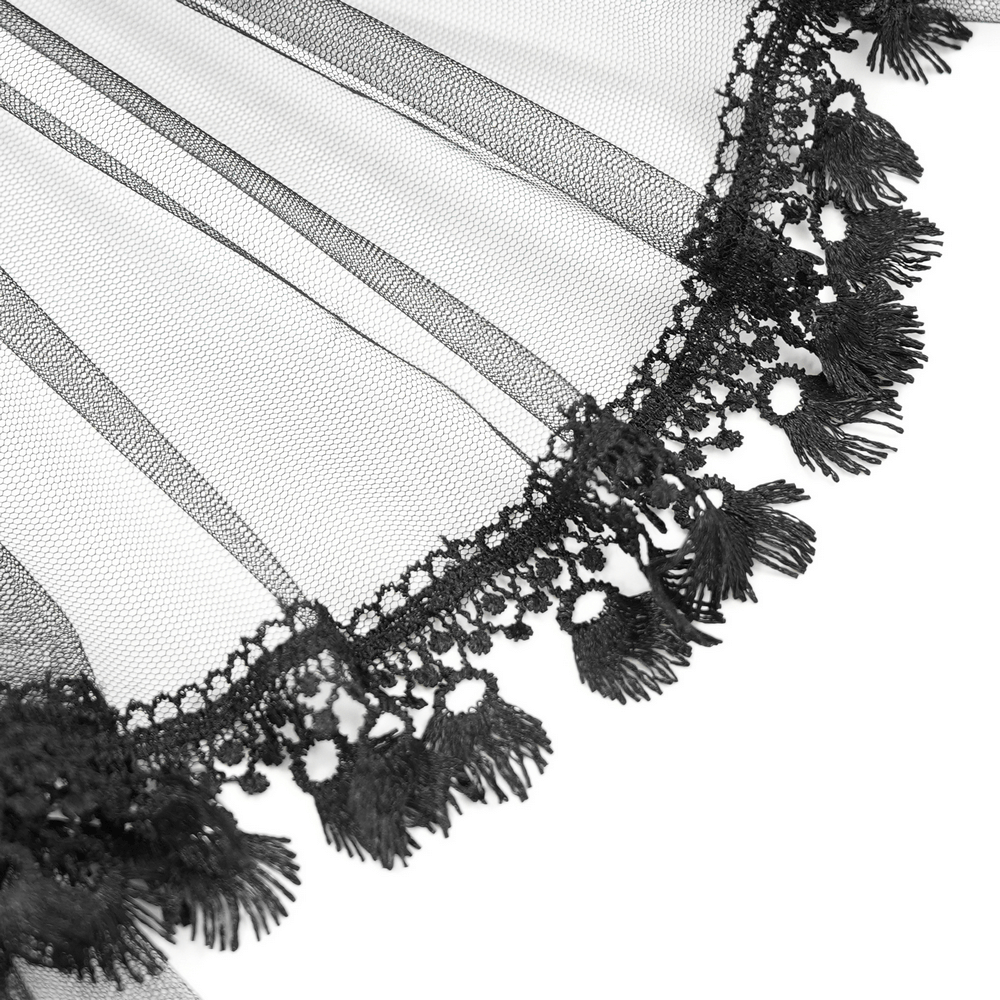 Close-up of delicate black lace and tulle fabric with intricate fringing, perfect for gothic fashion accents.