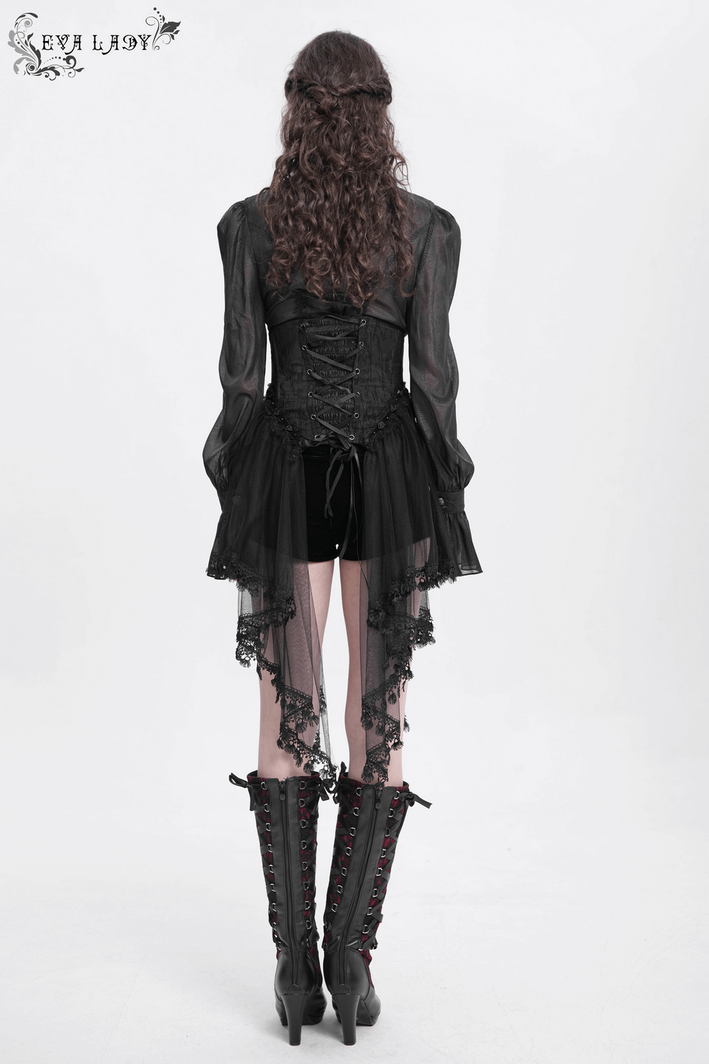Gothic style woman wearing a dark lace underbust corset with sheer sleeves and lace details, paired with knee-high boots.