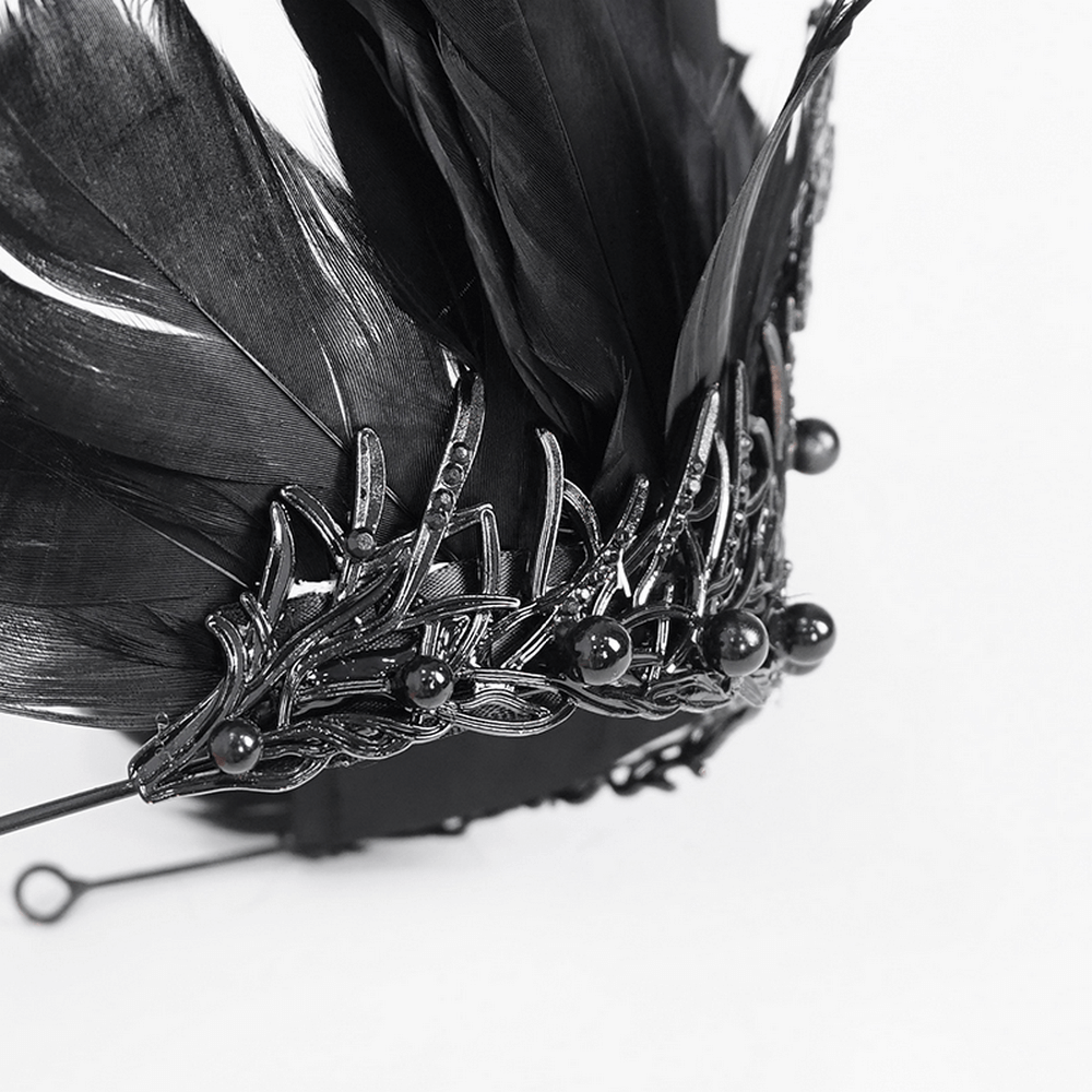 Dark fantasy women's feathered crown accessory with black feathers and intricate metal detailing.