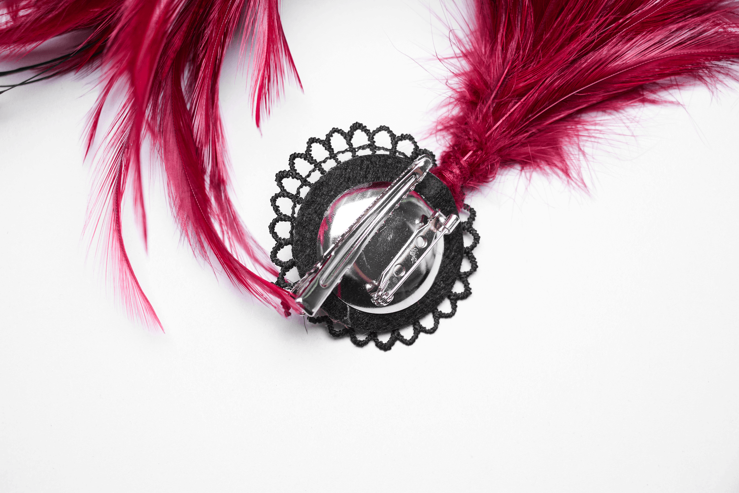 Elegant black clip for a gothic feather hair accessory, featuring vibrant red feathers and intricate lace design.