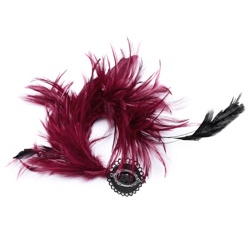 Dark feather hair accessory with a black crystal pendant, perfect for gothic or occult styles.