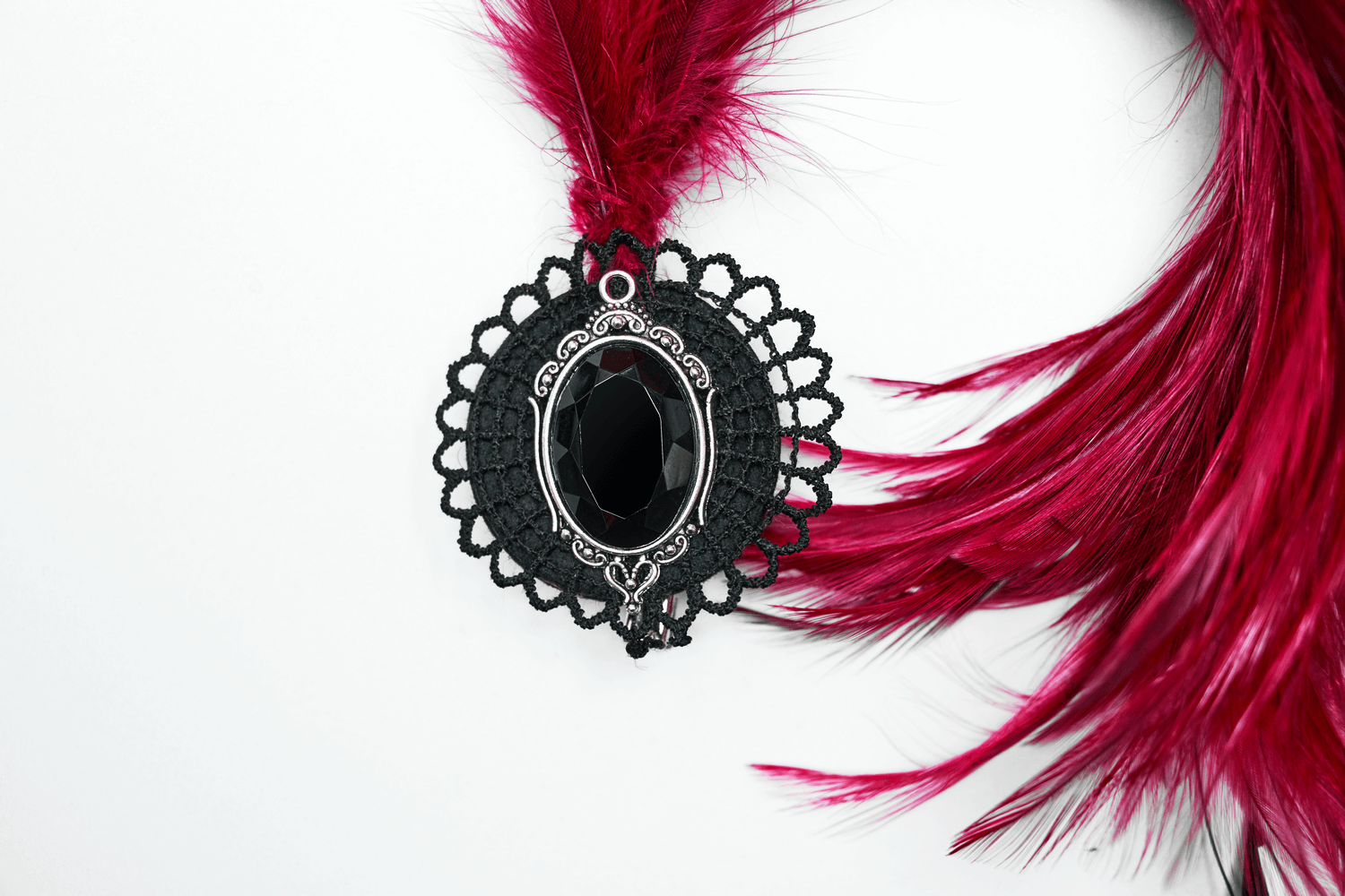 Dark feather gothic hair accessory featuring a black crystal pendant, perfect for occult styles.