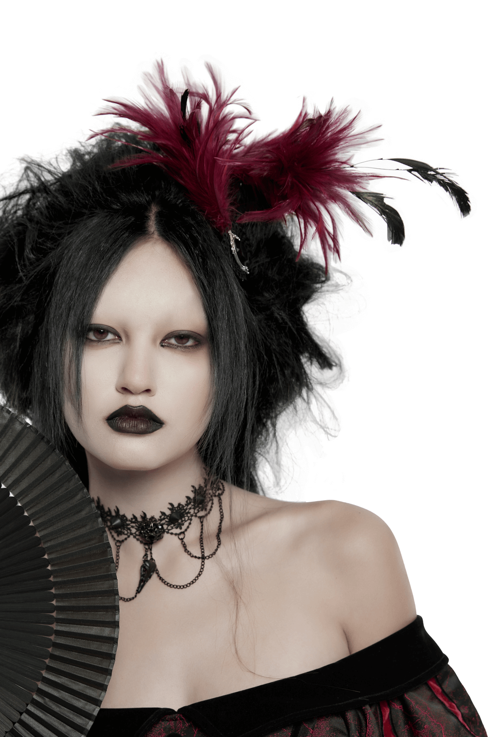 Model showcasing a dark feather gothic hair accessory with crystal pendant, exuding an occult aesthetic.