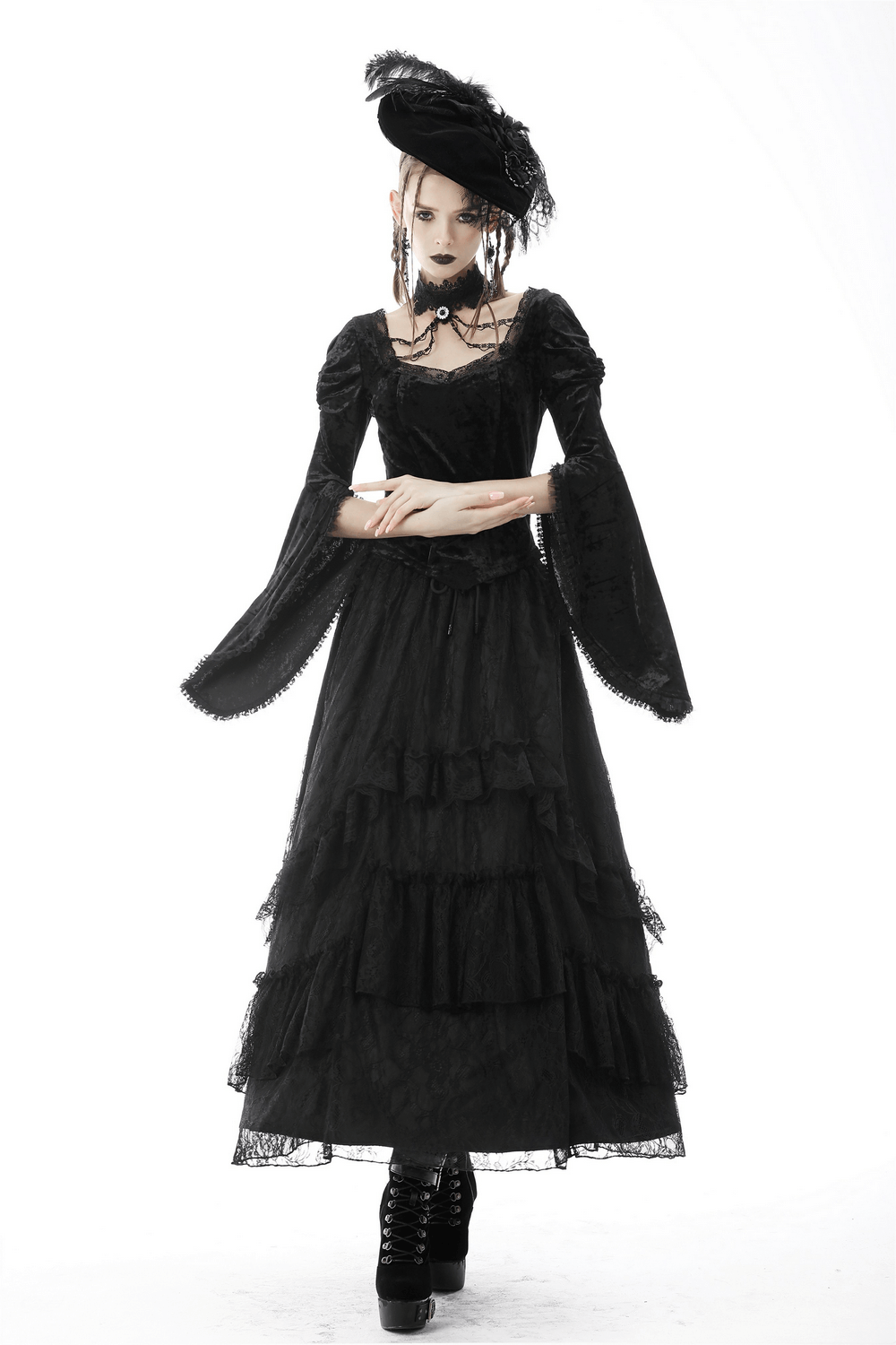 Gothic black lace maxi skirt with Victorian flair, showcasing tiered layers and dramatic sleeves, perfect for dark fashionistas.
