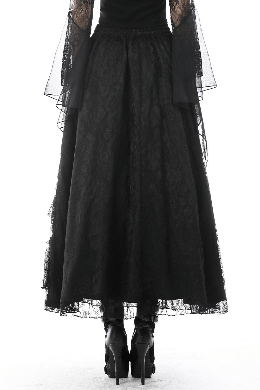 Back view of a black lace maxi skirt with a flowing mesh overlay and tiered lace trim, perfect for Victorian goth style.
