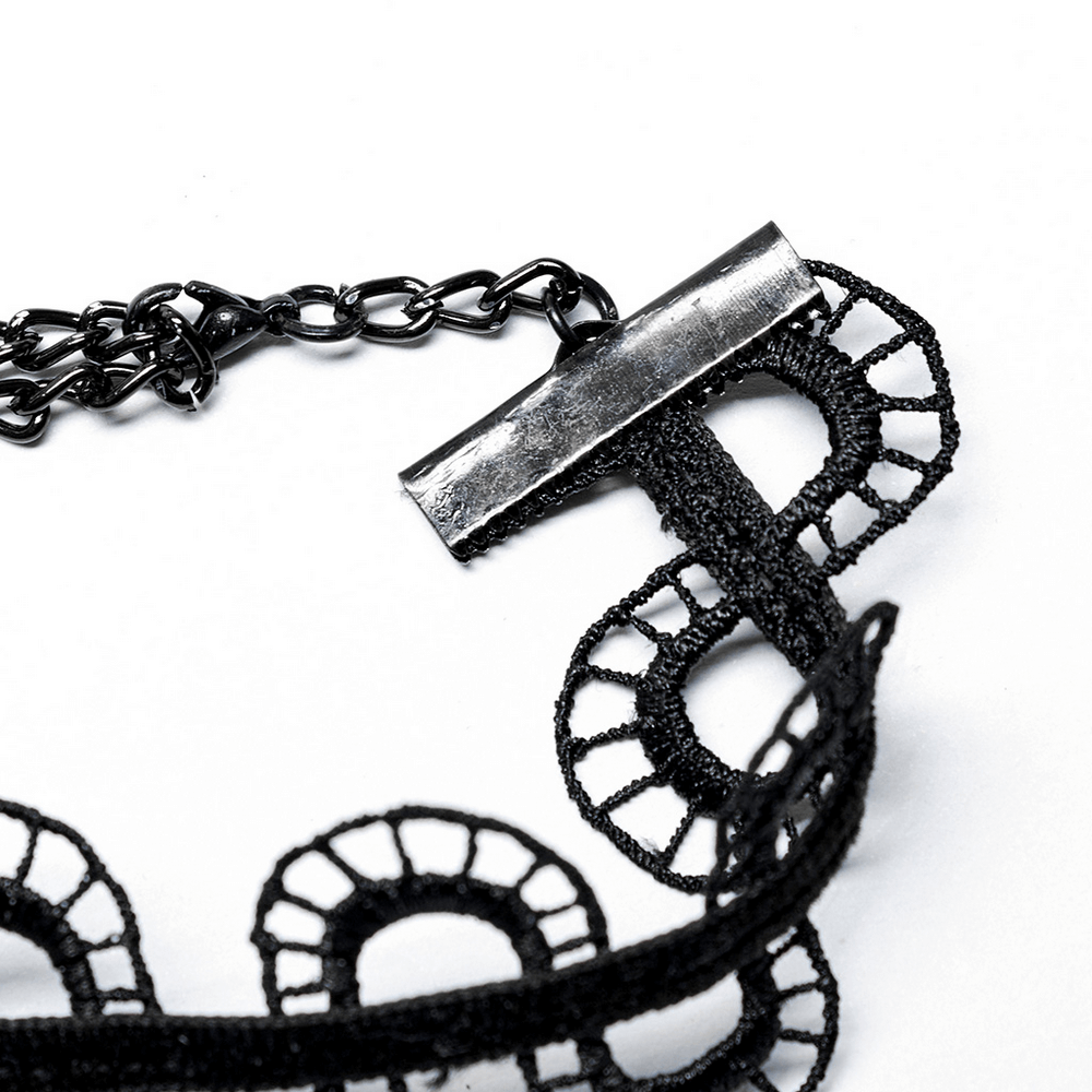 Close-up of a black lace snake choker necklace with an adjustable clasp, showcasing gothic elegance.