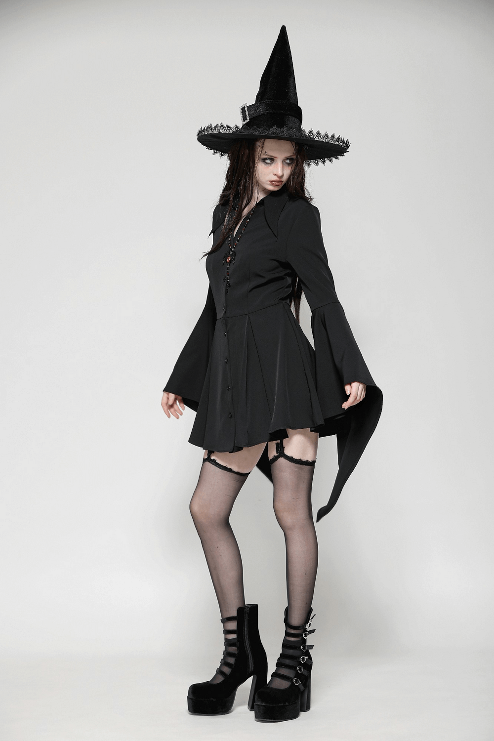 Dark goth dress with lace-up back, flared sleeves, and witch hat for an enchanting gothic look.