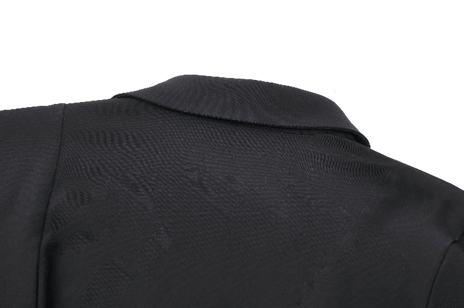 Close-up of the back collar of a black dress, featuring sleek fabric and structured design.