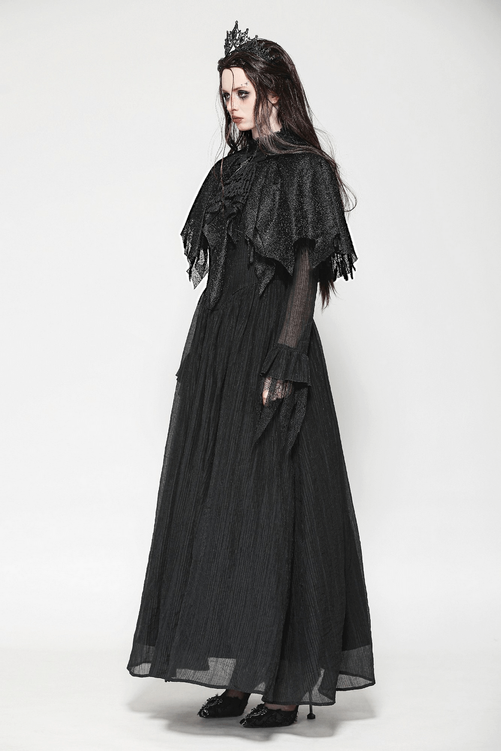 Dark goth fringed cape with lace details, showcasing Victorian elegance and a dramatic silhouette for women.