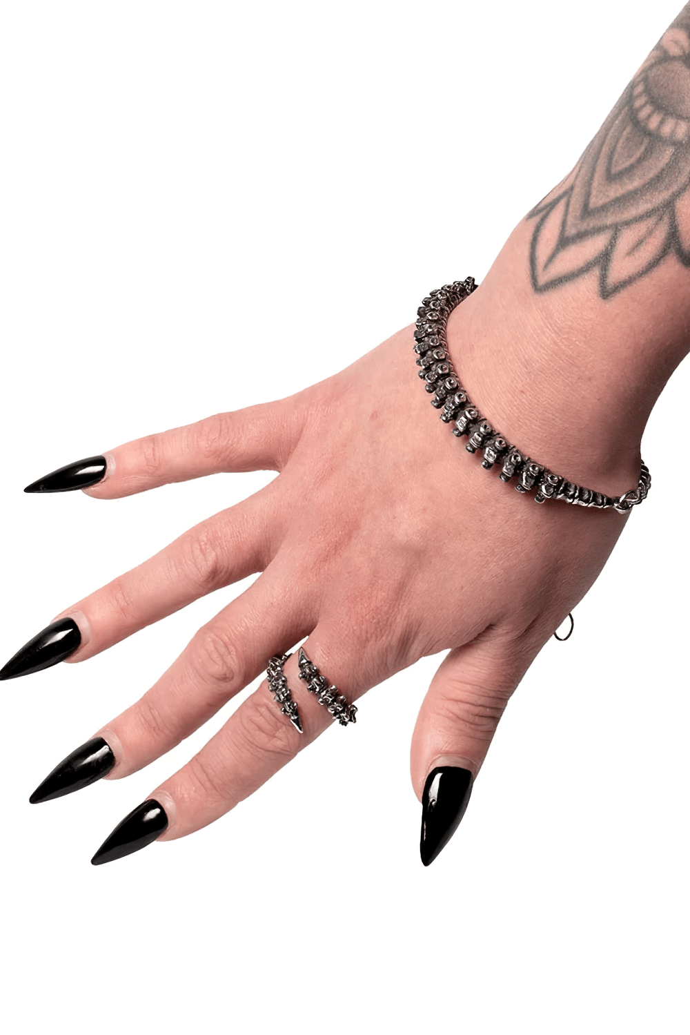 Dark Gothic Bracelet with Vertebrae Pewter Detail showcased on a hand with striking black nails and tattoos.