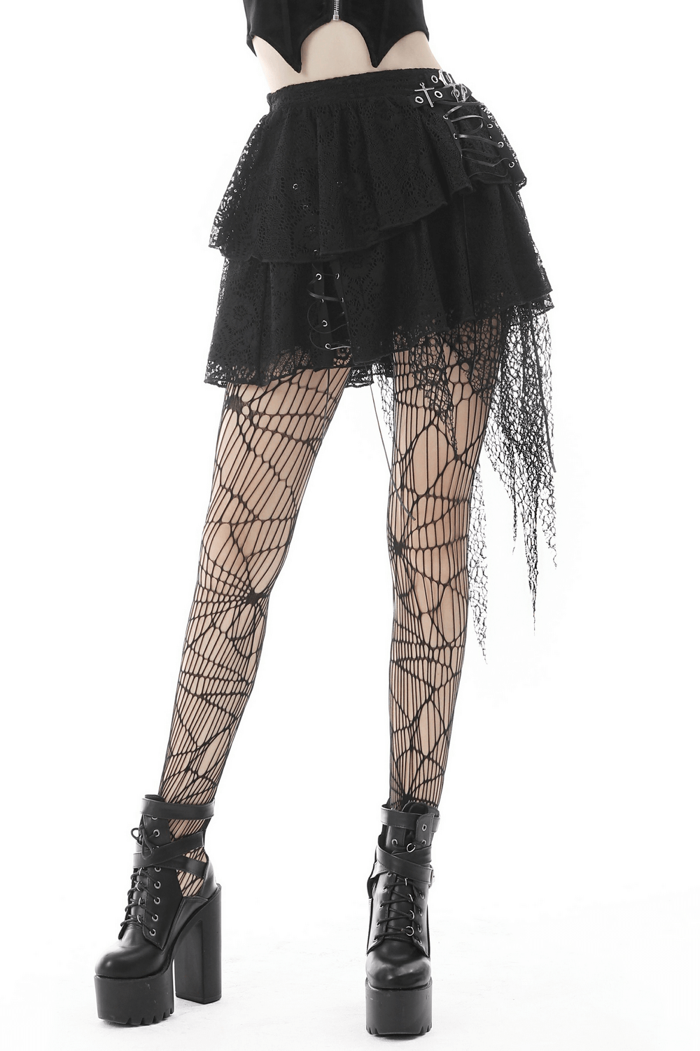 Dark gothic lace mini skirt with edgy mesh overlay, paired with fishnet tights and chunky platform boots.