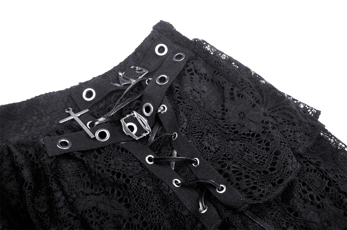 Close-up of dark gothic lace mini skirt featuring edgy mesh and strappy detailing for a punk vibe.