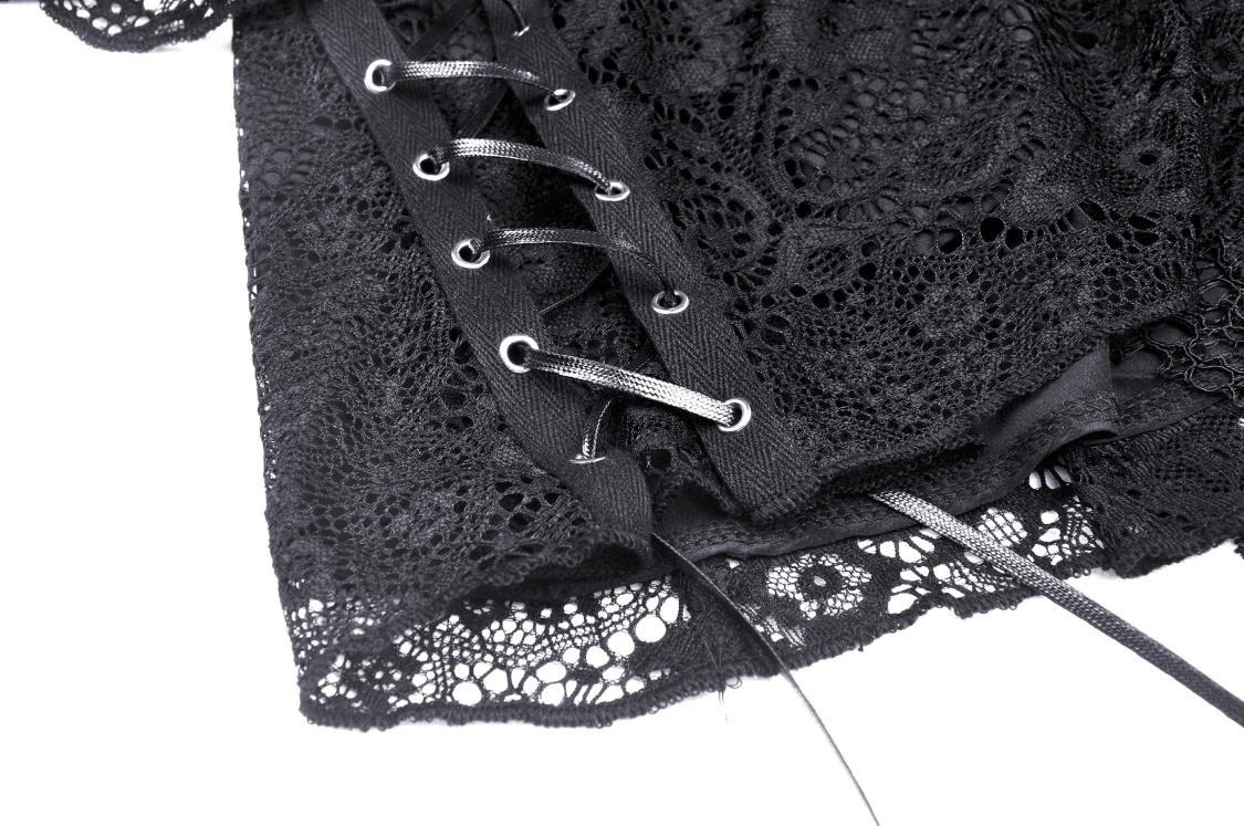 Close-up of dark gothic lace mini skirt with strappy detailing and layered lace for a punk vibe.