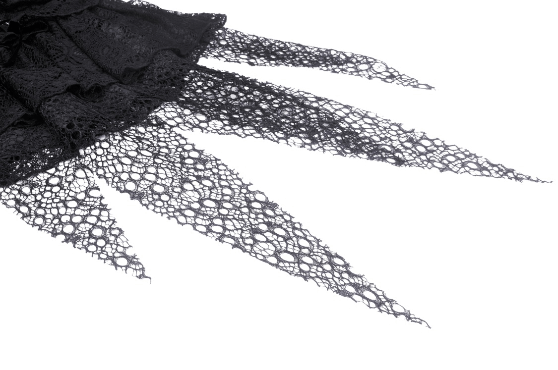 Close-up of intricate black lace detail from a dark gothic mini skirt with edgy mesh overlay.