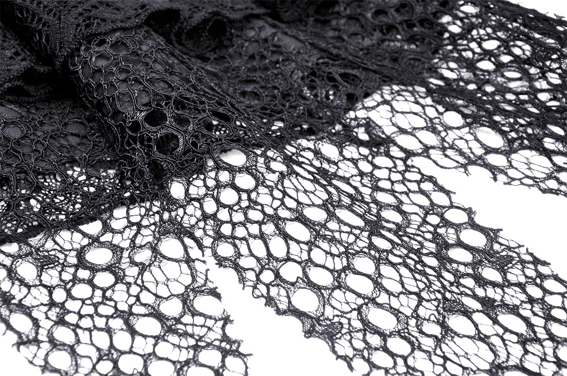 Close-up of dark gothic lace featuring intricate patterns, ideal for punk-inspired fashion and edgy designs.