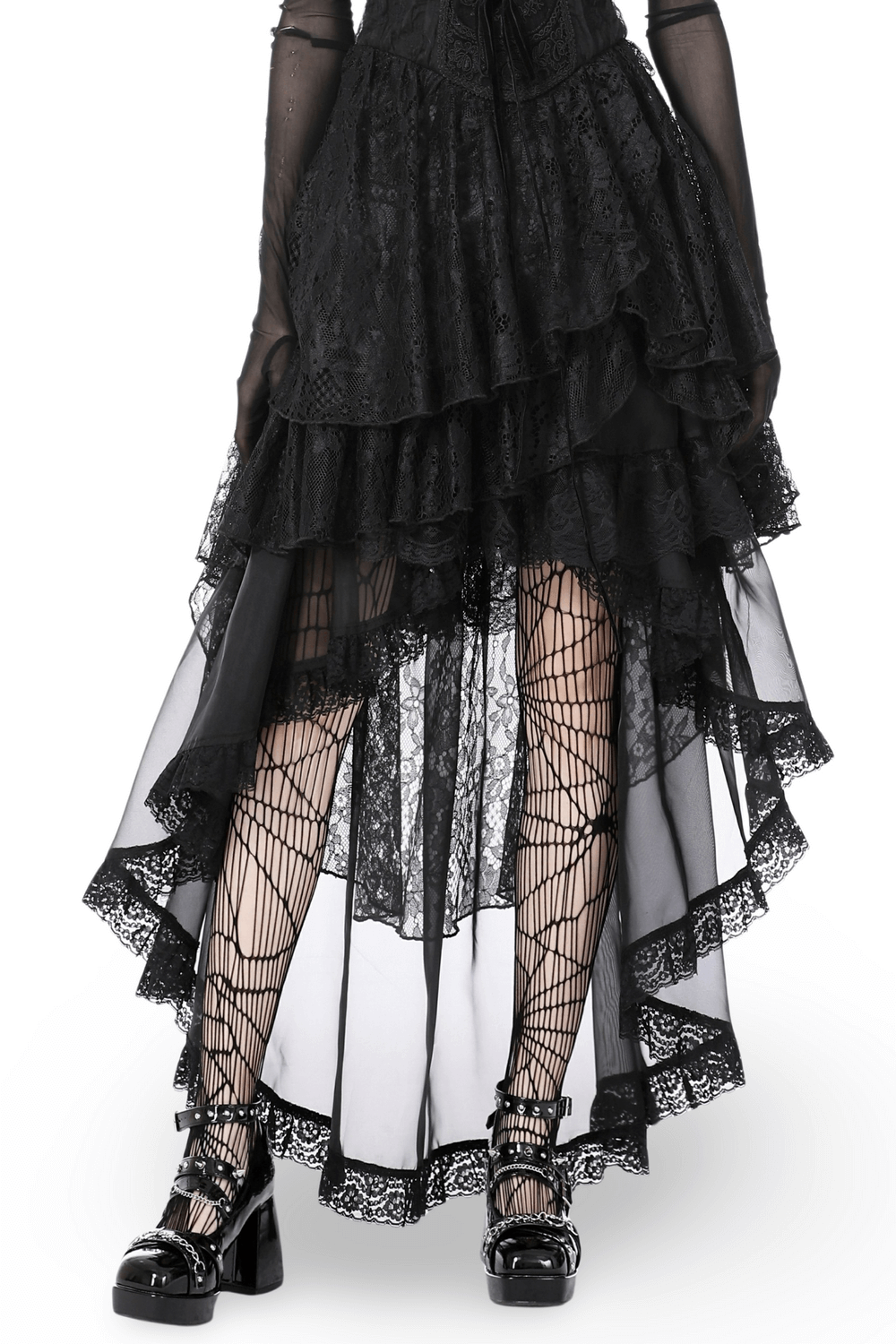 Flowy black gothic high-low chiffon skirt with lace trim, paired with fishnet tights and chunky shoes.