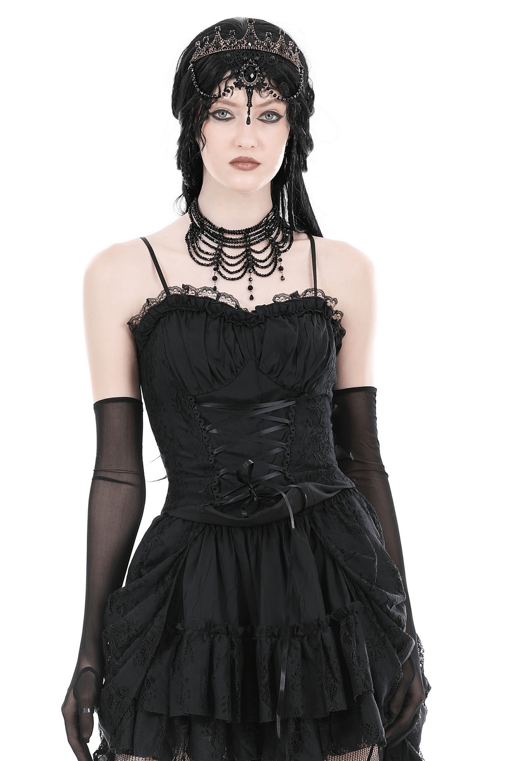 Dramatic dark gothic lace-up corset top with lace trim and elegant black accessories.