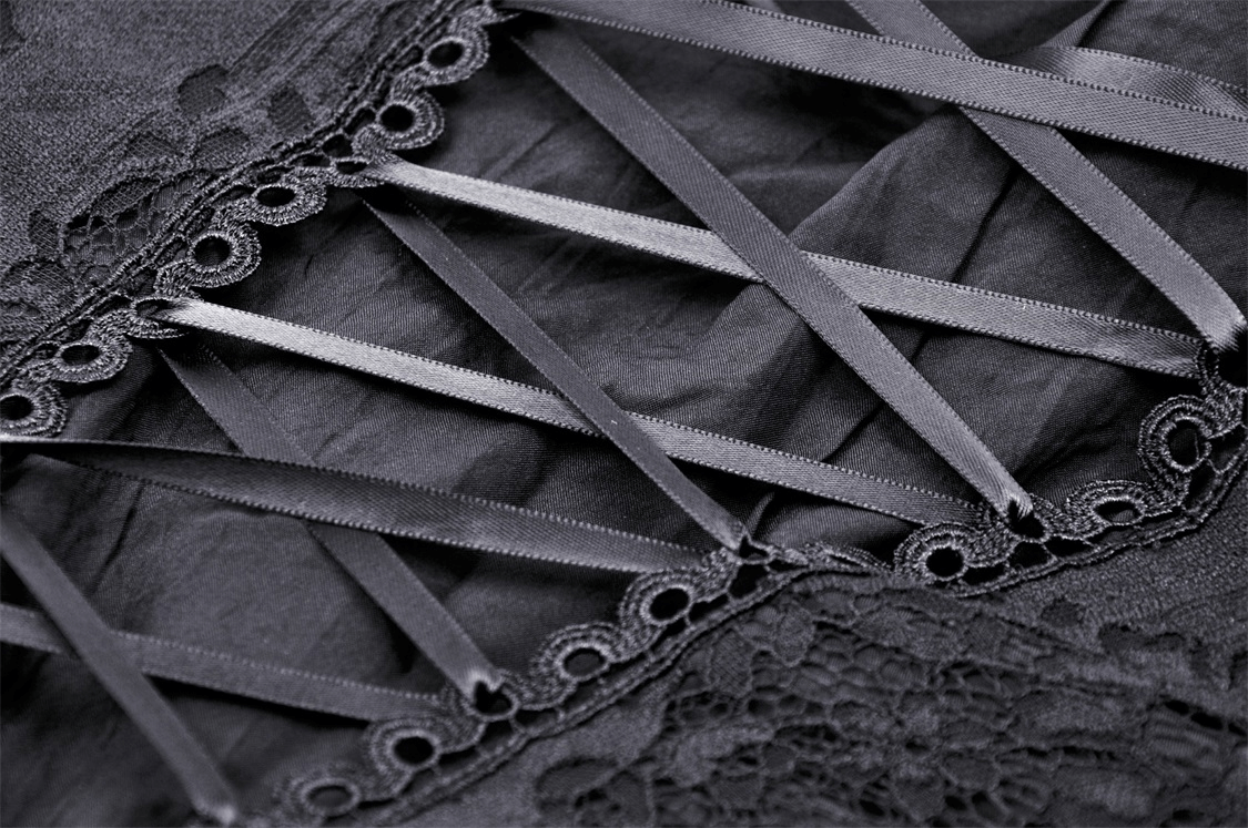 Detailed view of dark gothic lace-up corset featuring intricate lace trim and ribbon detailing.