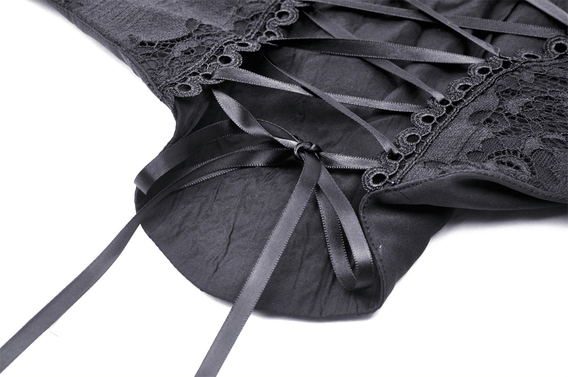 Close-up of black gothic lace-up bustier corset with lace trim and ribbon detailing.
