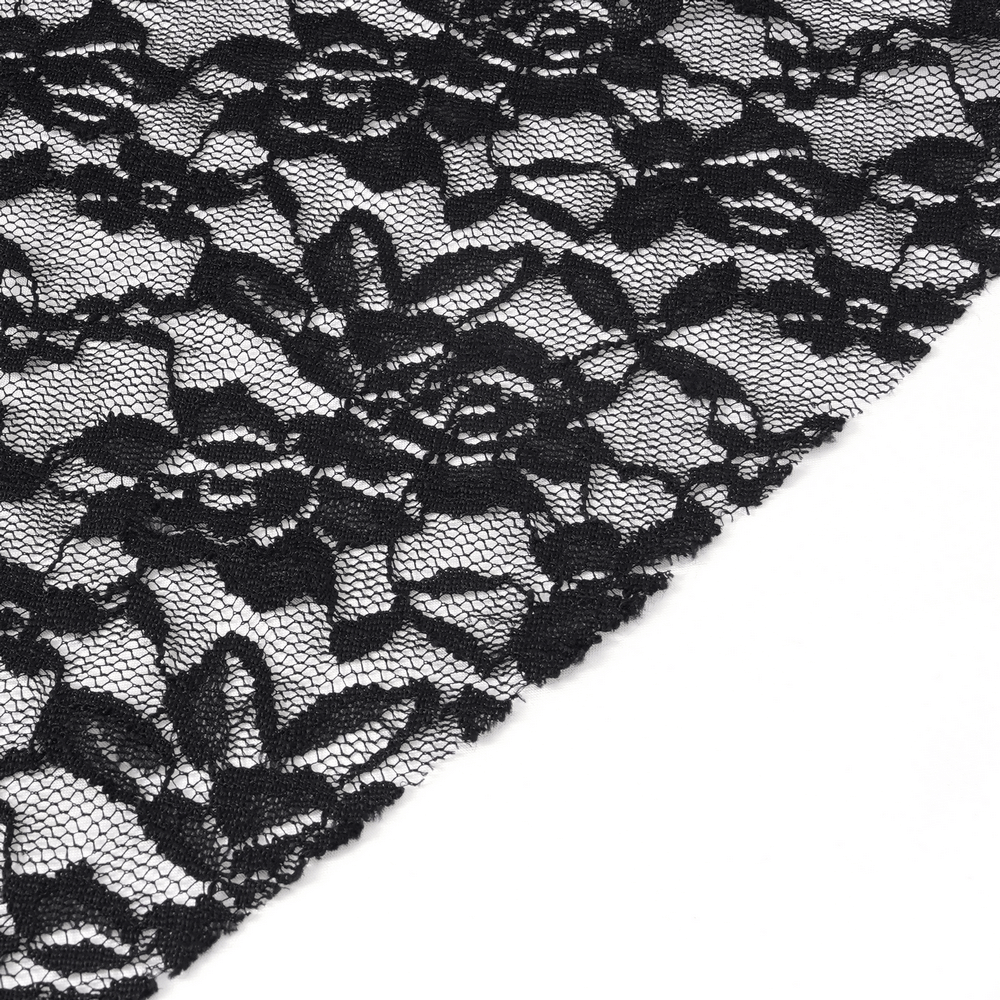 Black floral lace fabric detail, showcasing intricate pattern design.