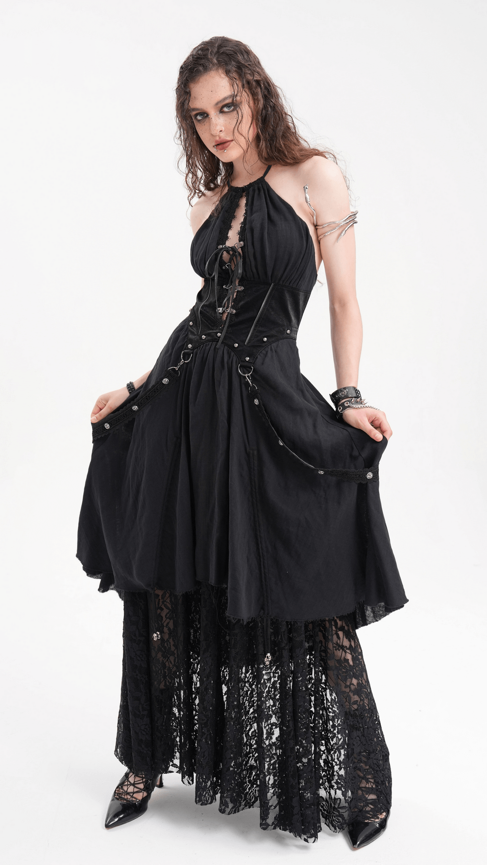 Dark gothic layered dress with lace, corset details, and chain accents for an elegant alternative fashion look.