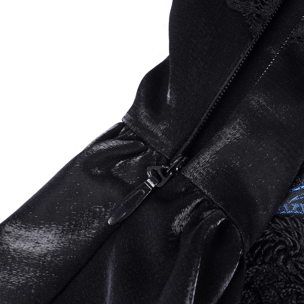 Close-up of Gothic lace and satin dress zipper detail in dark blue and black fabric.