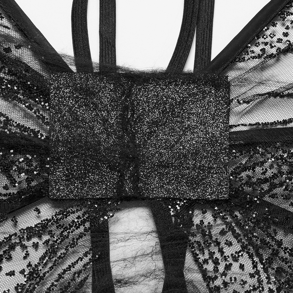 Close-up of dark gothic butterfly wings showing adjustable straps and shimmering black mesh details.