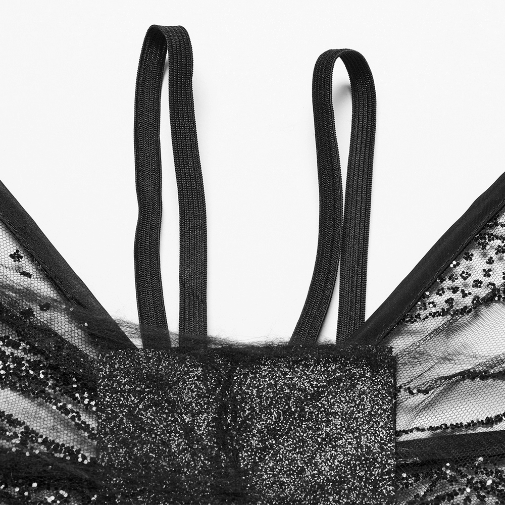 Close-up of adjustable straps on dark gothic mesh butterfly wings with shimmering texture.