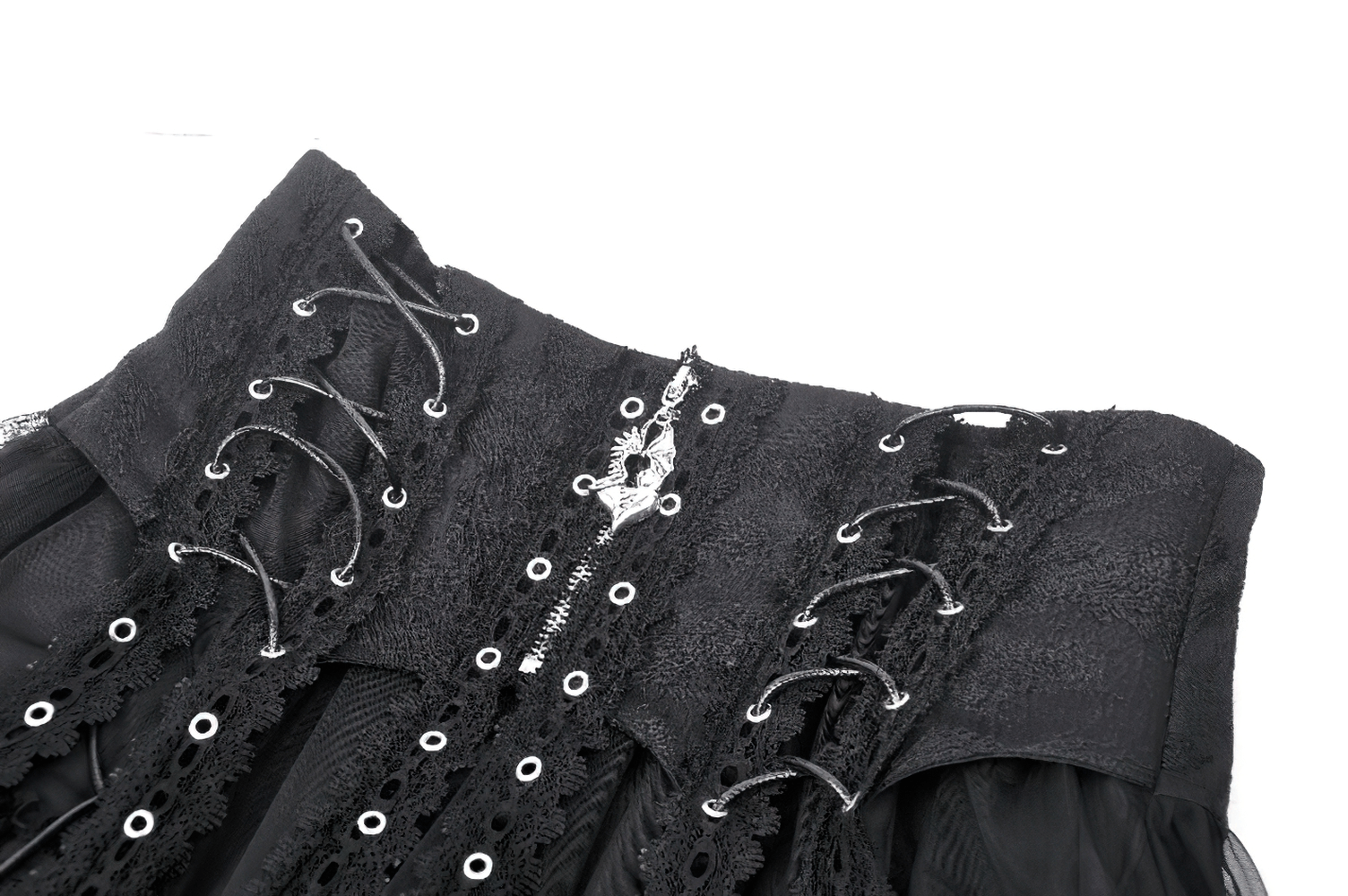 Close-up of black gothic mini skirt featuring lace trim and cross detail, showcasing edgy design and intricate lacing.