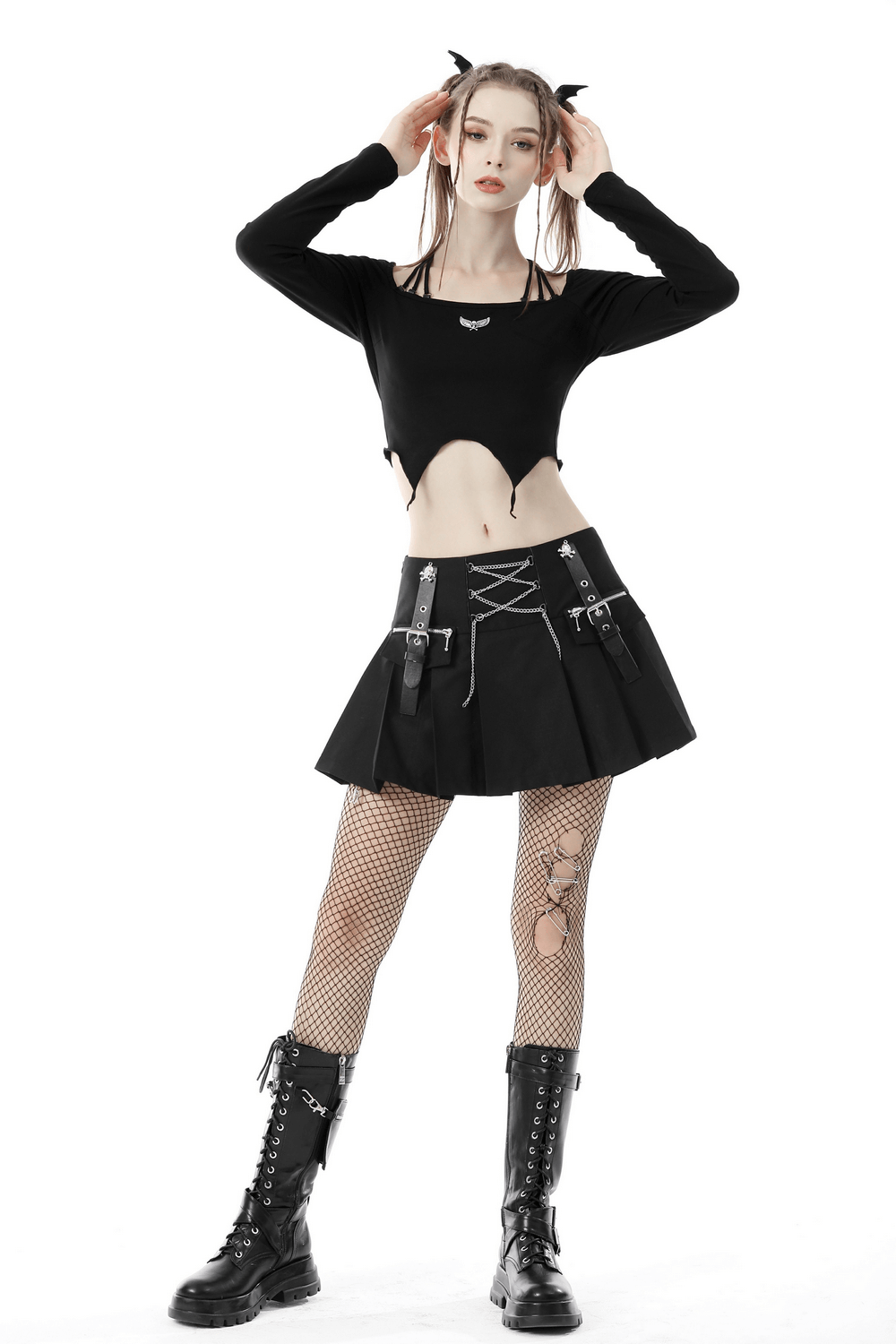 Edgy model in black halter top with skirt, showcasing gothic style and punk fashion. Perfect for a bold outfit.