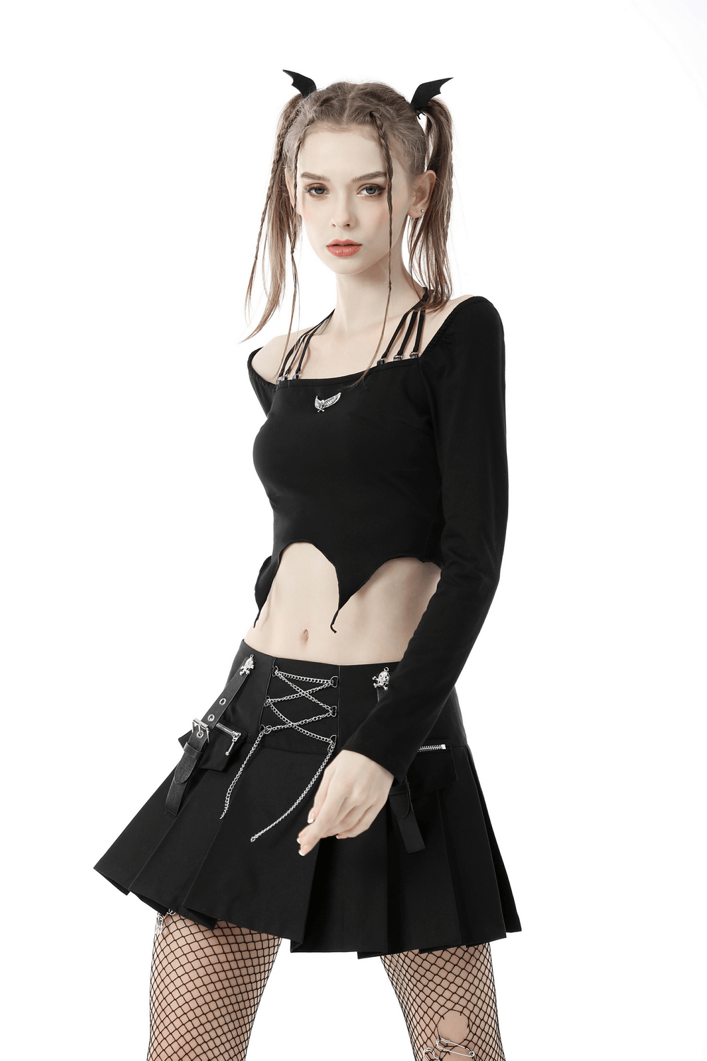 Edgy black gothic multi-rope halter top with skull and wings, stylishly paired with a black pleated skirt.