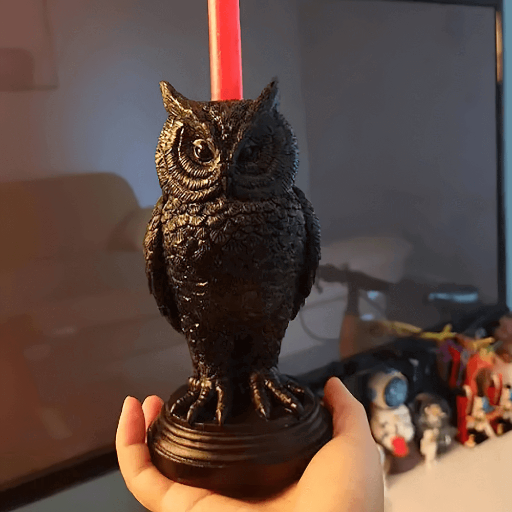 Gothic owl candle holder in black resin, featuring a red candle, ideal for mystical home decor and eerie atmospheres.