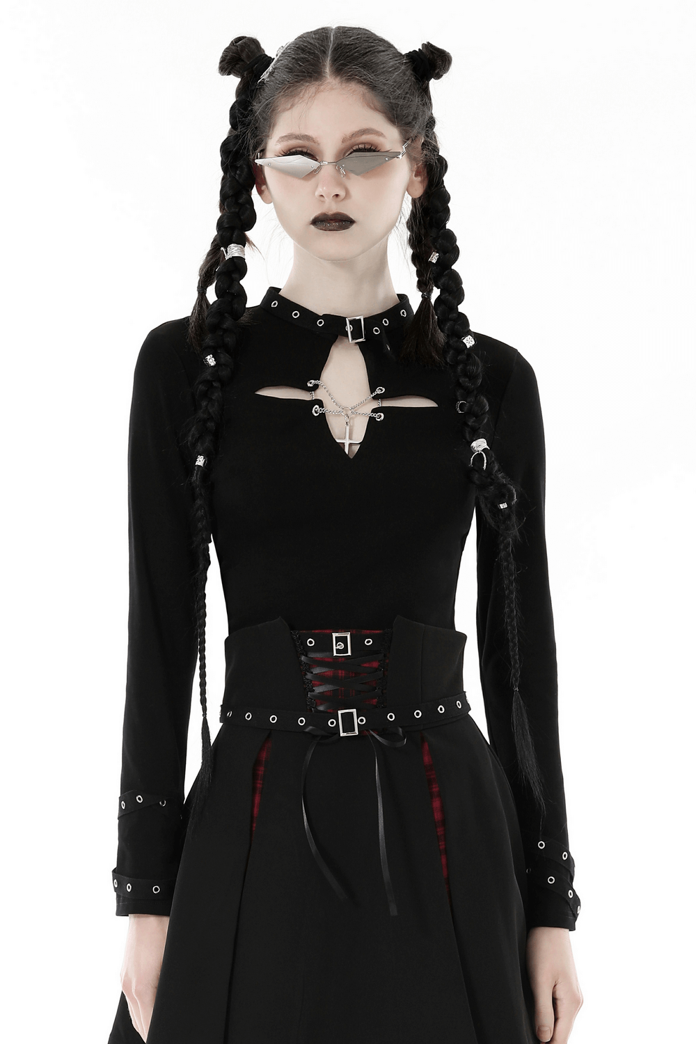 Edgy dark gothic punk women's crop top with cross cutout and o-ring choker, styled with black dress pants.