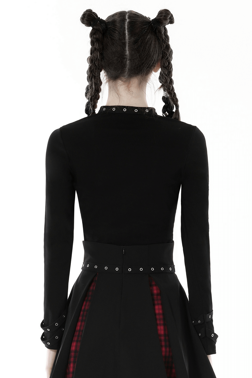 Back view of a dark gothic punk women's cutout cross crop top with long sleeves and studded details.