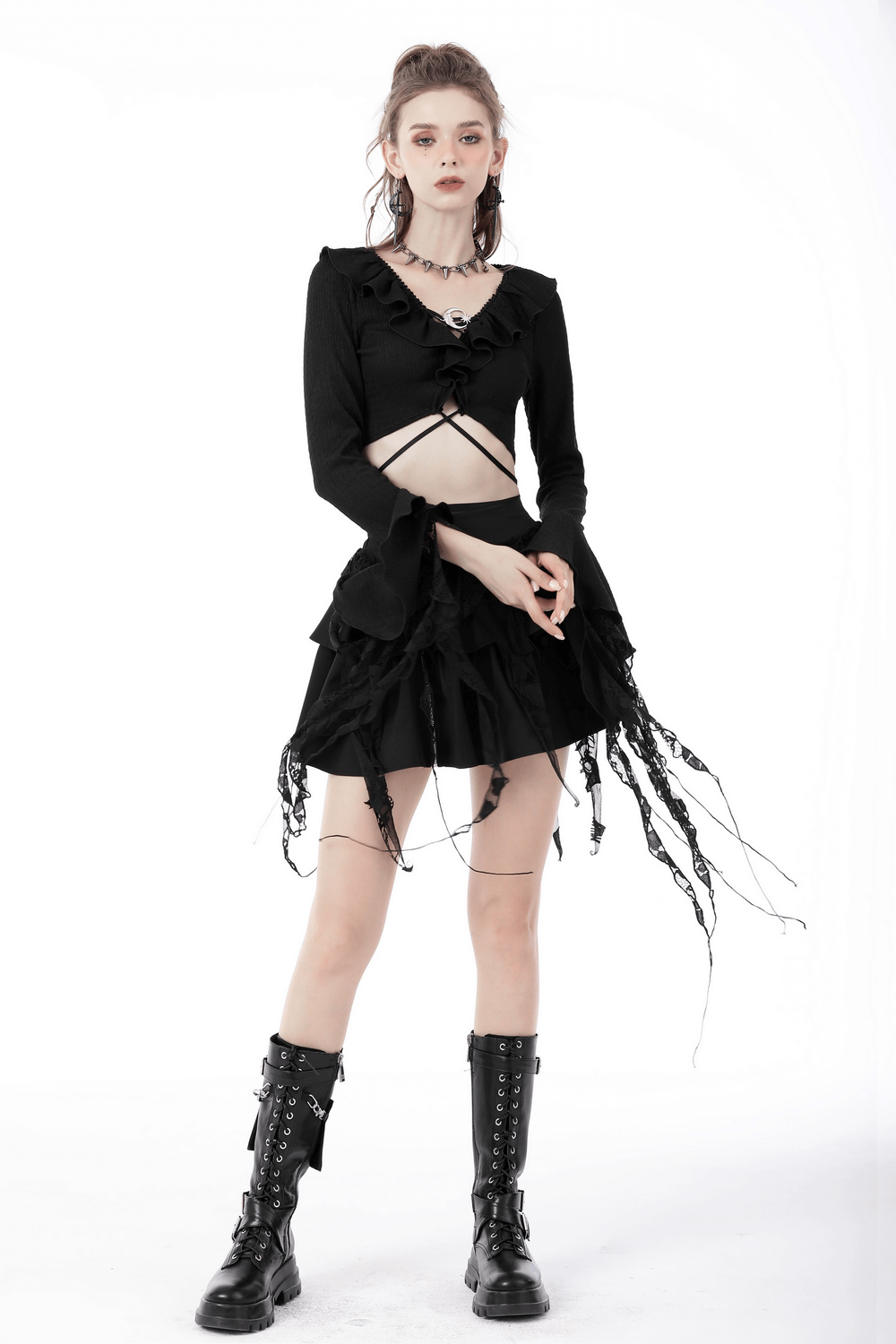 Black gothic ruffle neck crop top with ripped sleeves, styled with a flared skirt and edgy boots.