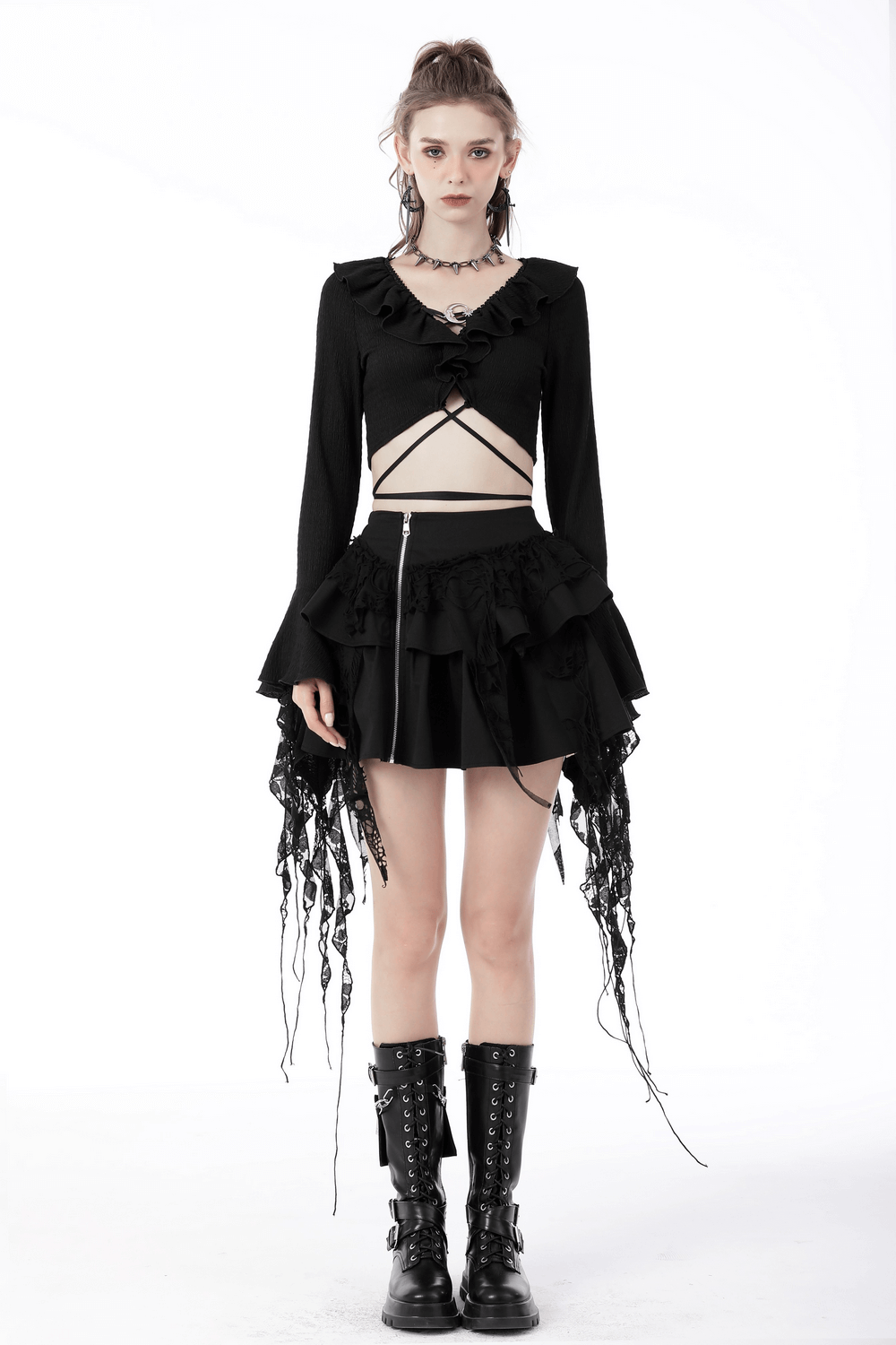 Dark gothic crop top with ruffle neck and ripped sleeves, styled with a layered skirt and edgy accessories.