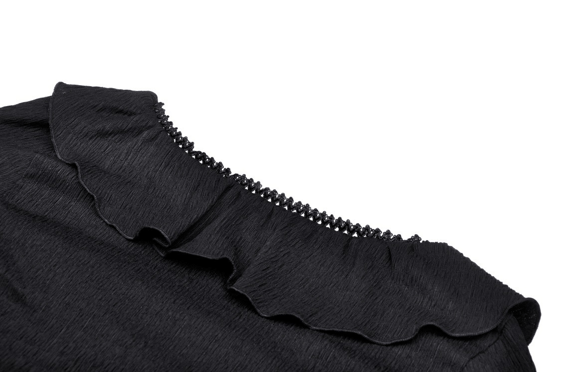 Close-up of dark gothic crop top's ruffle neck detail, showcasing edgy style and soft fabric texture.