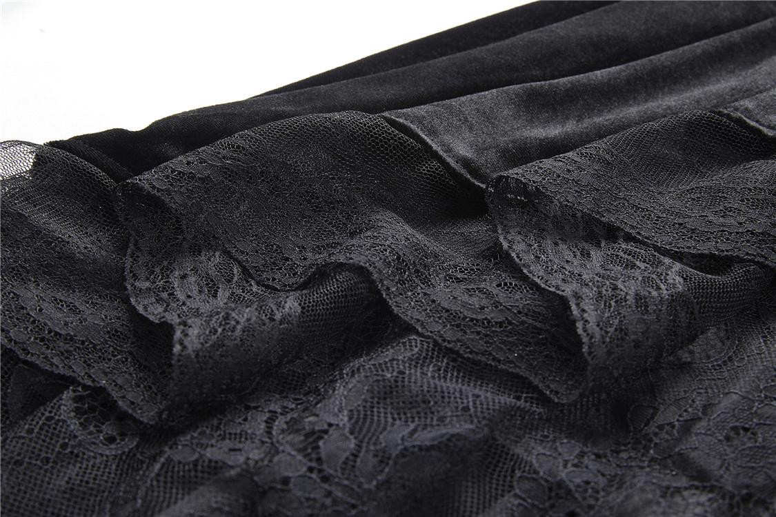 Close-up of dark velvet lace hem showcasing Victorian elegance in a gothic skirt.