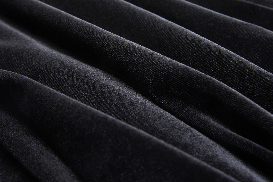Close-up of luxurious black velvet fabric, perfect for crafting a dramatic gothic skirt.